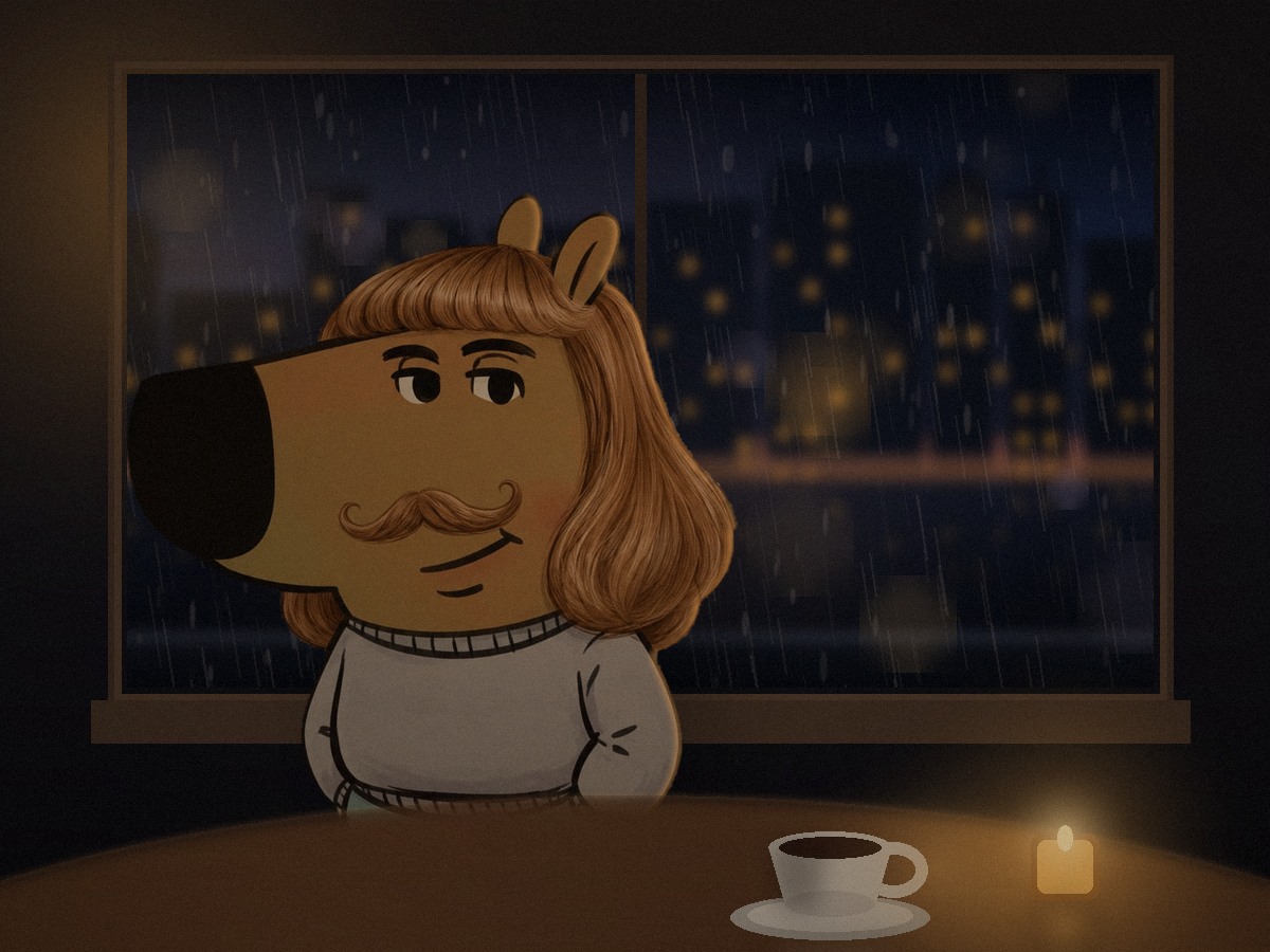 Phil Guy alone at a table by a rainy window